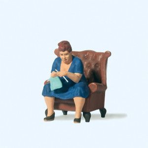 Seated Woman Knitting Figure